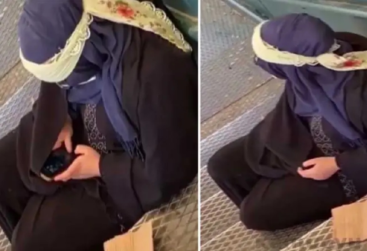 متسولة تستخدم آيفون 11 بروماكس 
